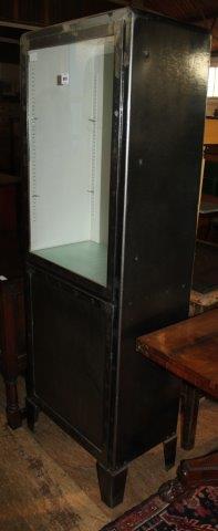 A metal cabinet with glass front(-)